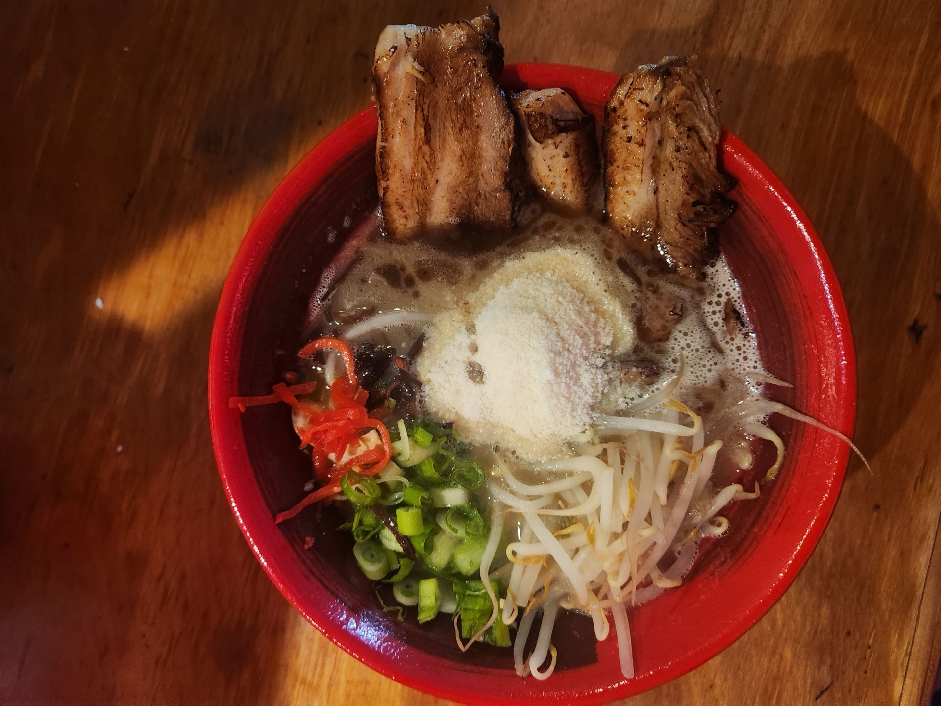 Cheese Chashu Tonkotsu ramen topped with melted parmesan and torch-finished chashu
