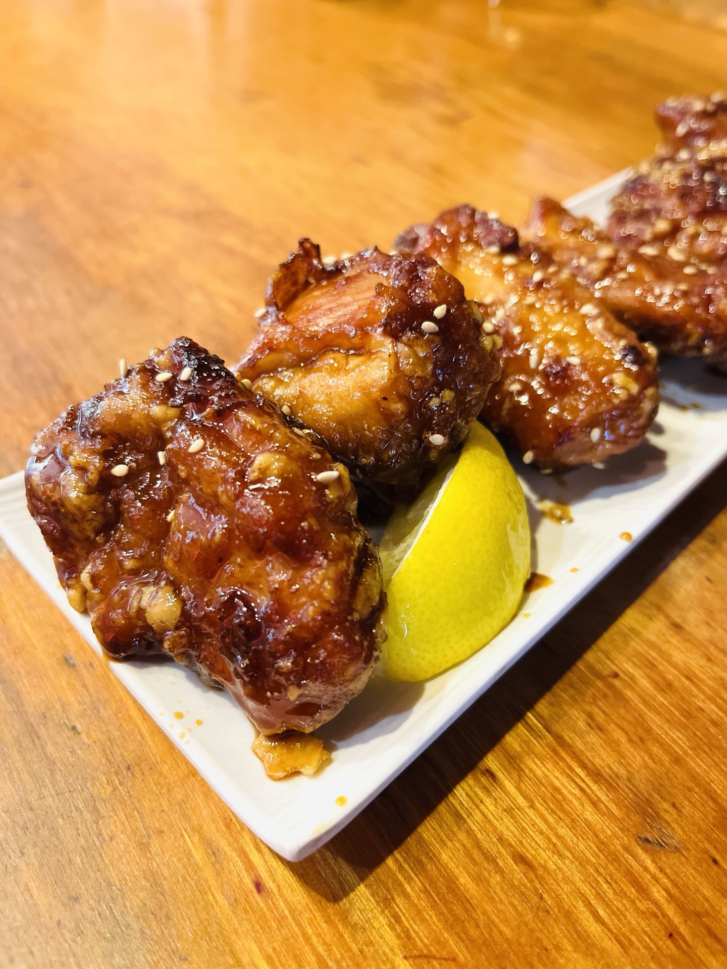 Karaage crispy Japanese fried chicken with spicy soy glaze and sesame