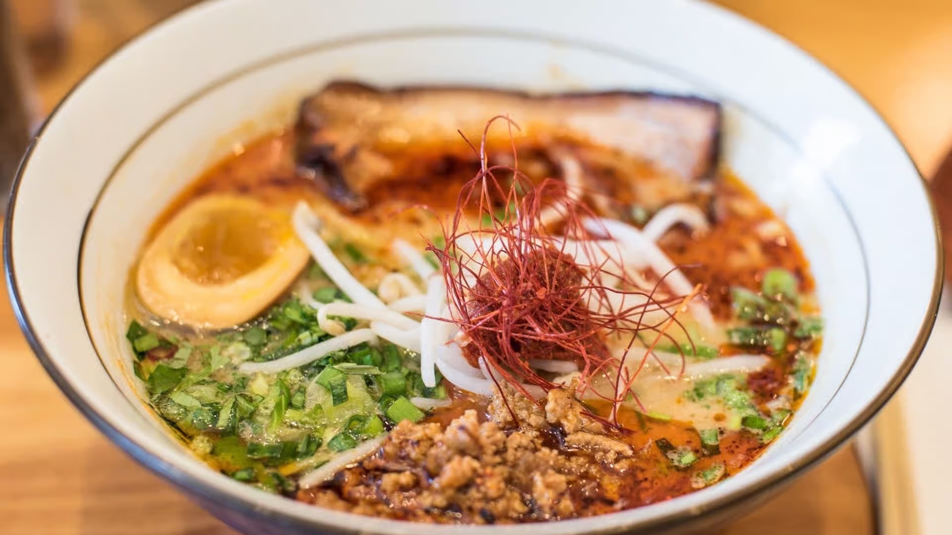 Miso ramen with sliced pork belly and fresh cilantro